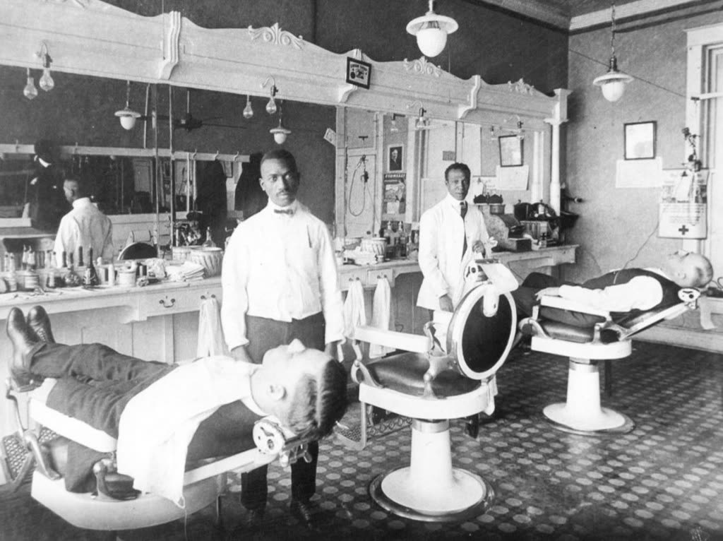 Historic barbershop scene with barbers and customers